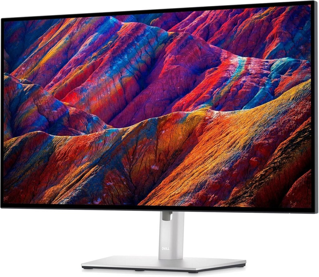Dell UltraSharp U2723QE Review 2026 monitor on minimalist desk setup with laptop and keyboard