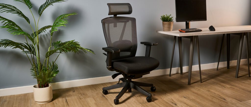 Autonomous ErgoChair Pro in a modern desk setup with ergonomic workspace design